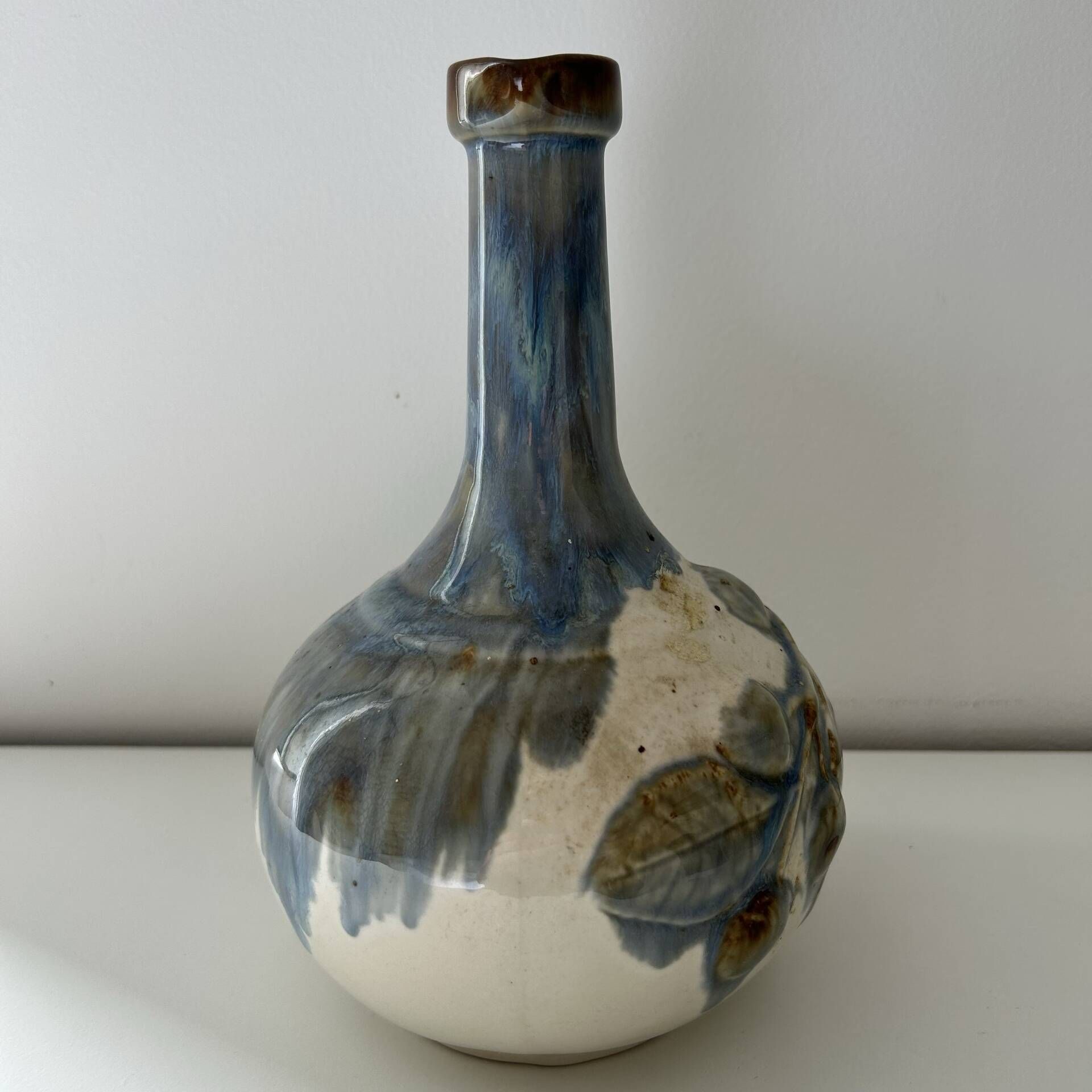 Cherry-decorated earthenware carafe