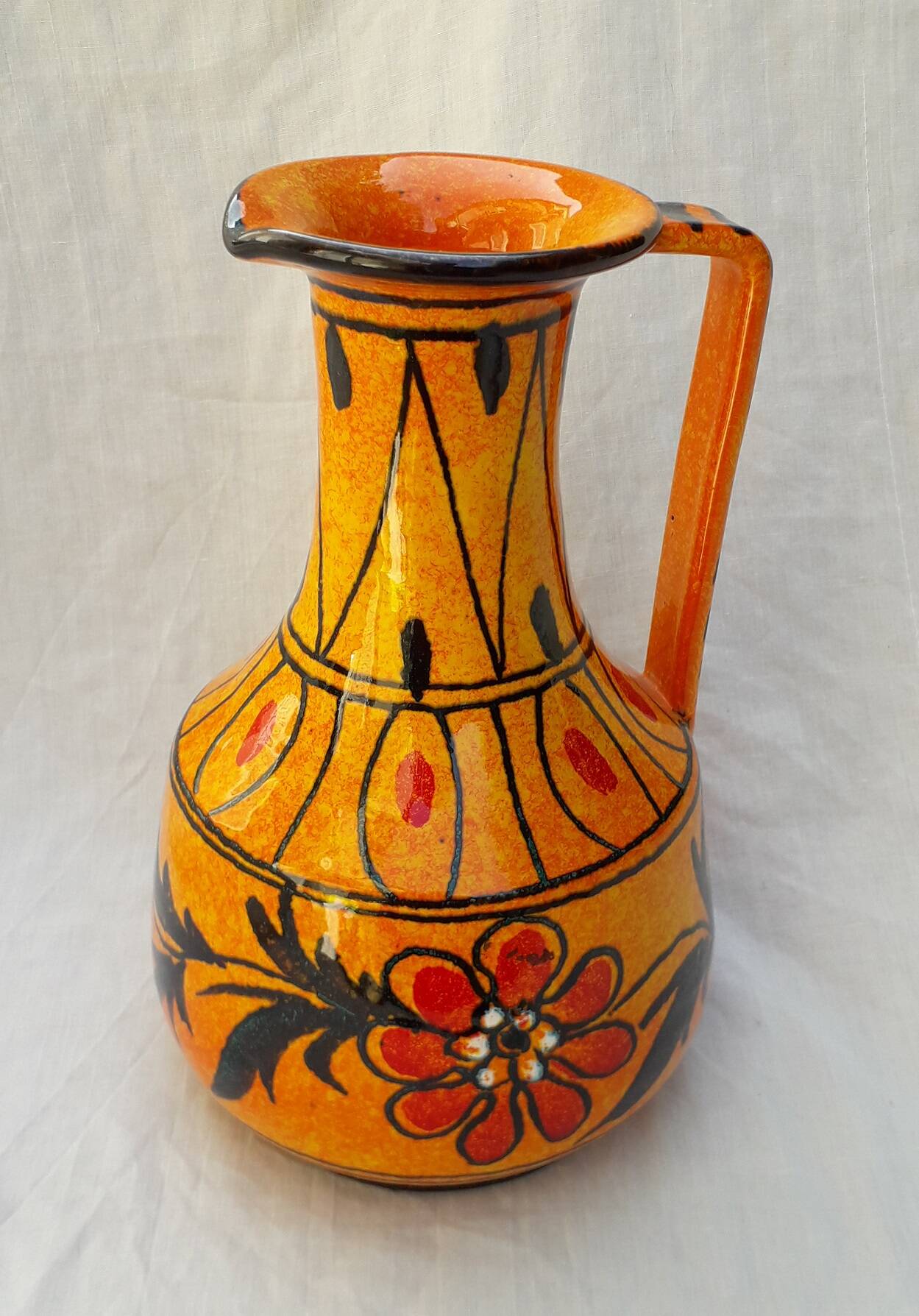 Orange ceramic jug
