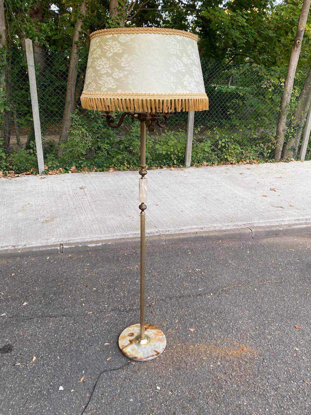 Vintage brass onyx floor lamp with fringed shade.