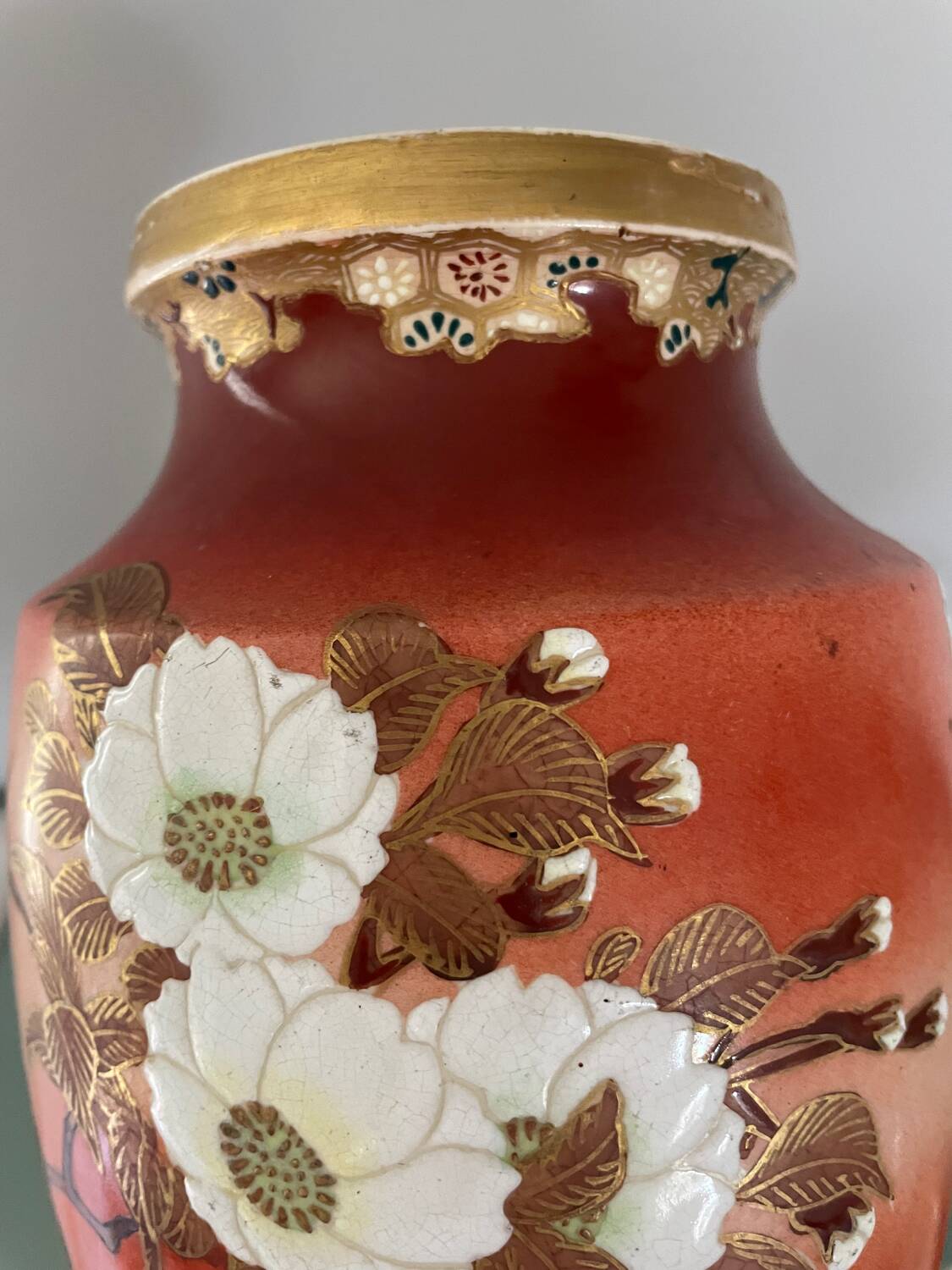 Pair of antique vases with butterfly and flower motif.