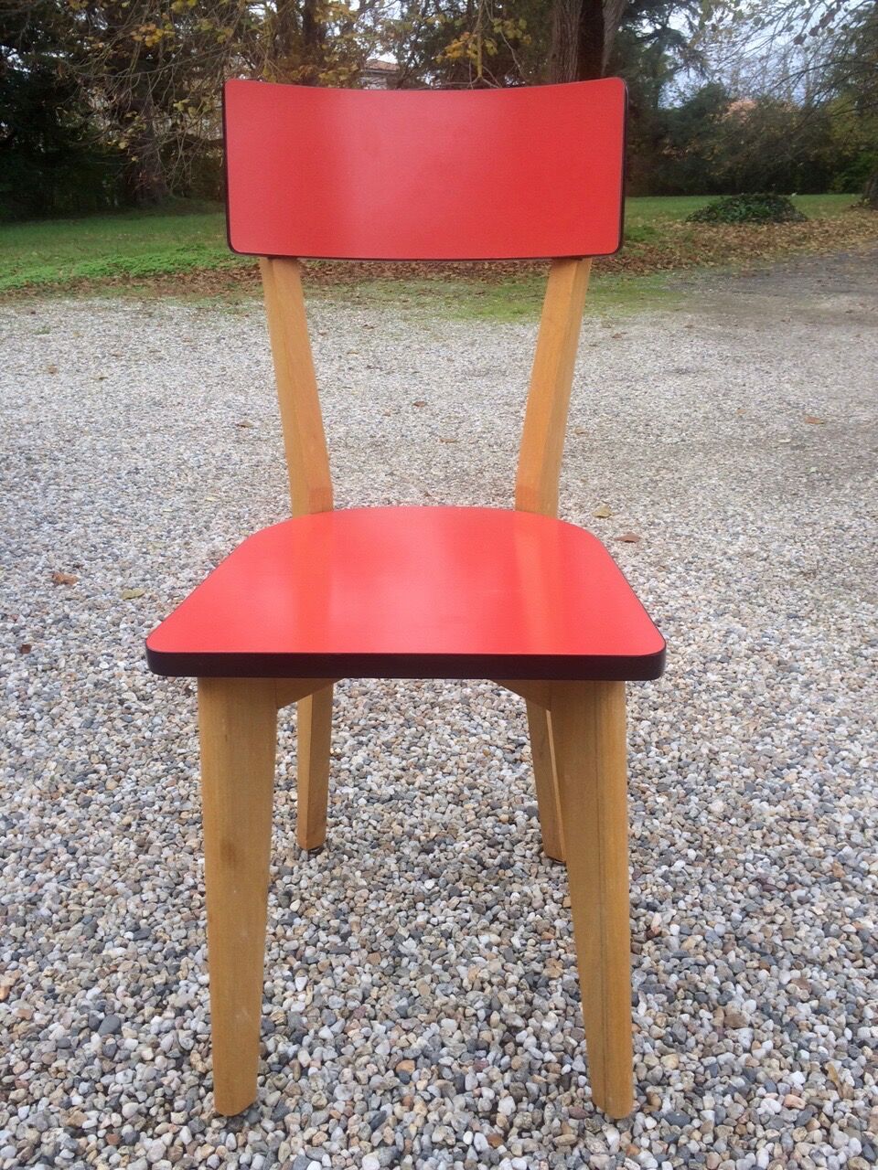 Eight wooden and formica chairs