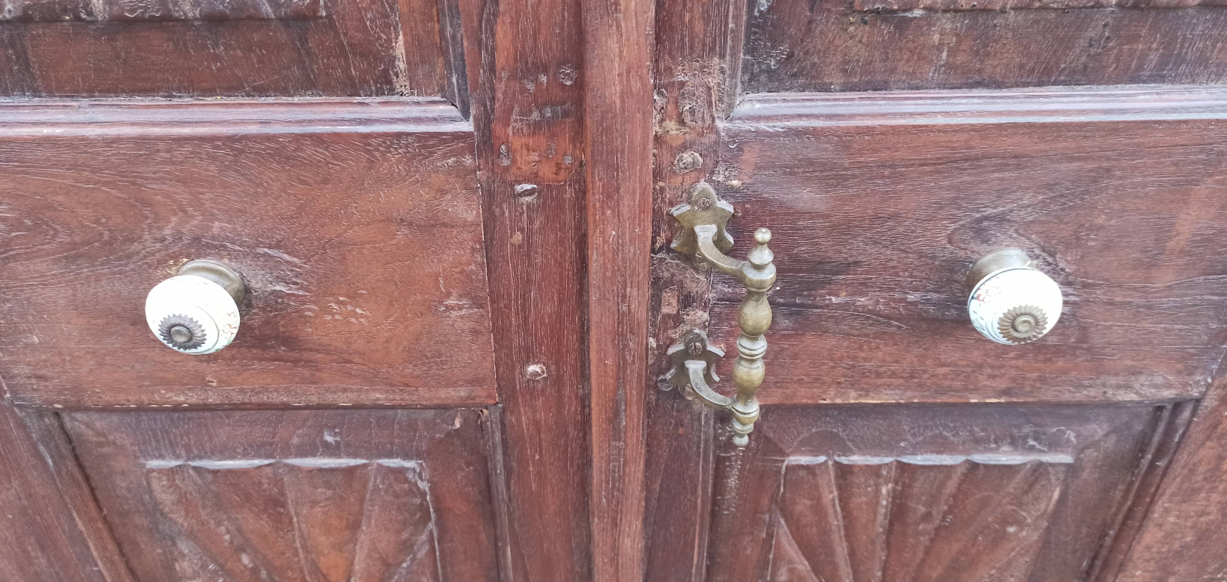 Old wooden cabinet with ceramic handles