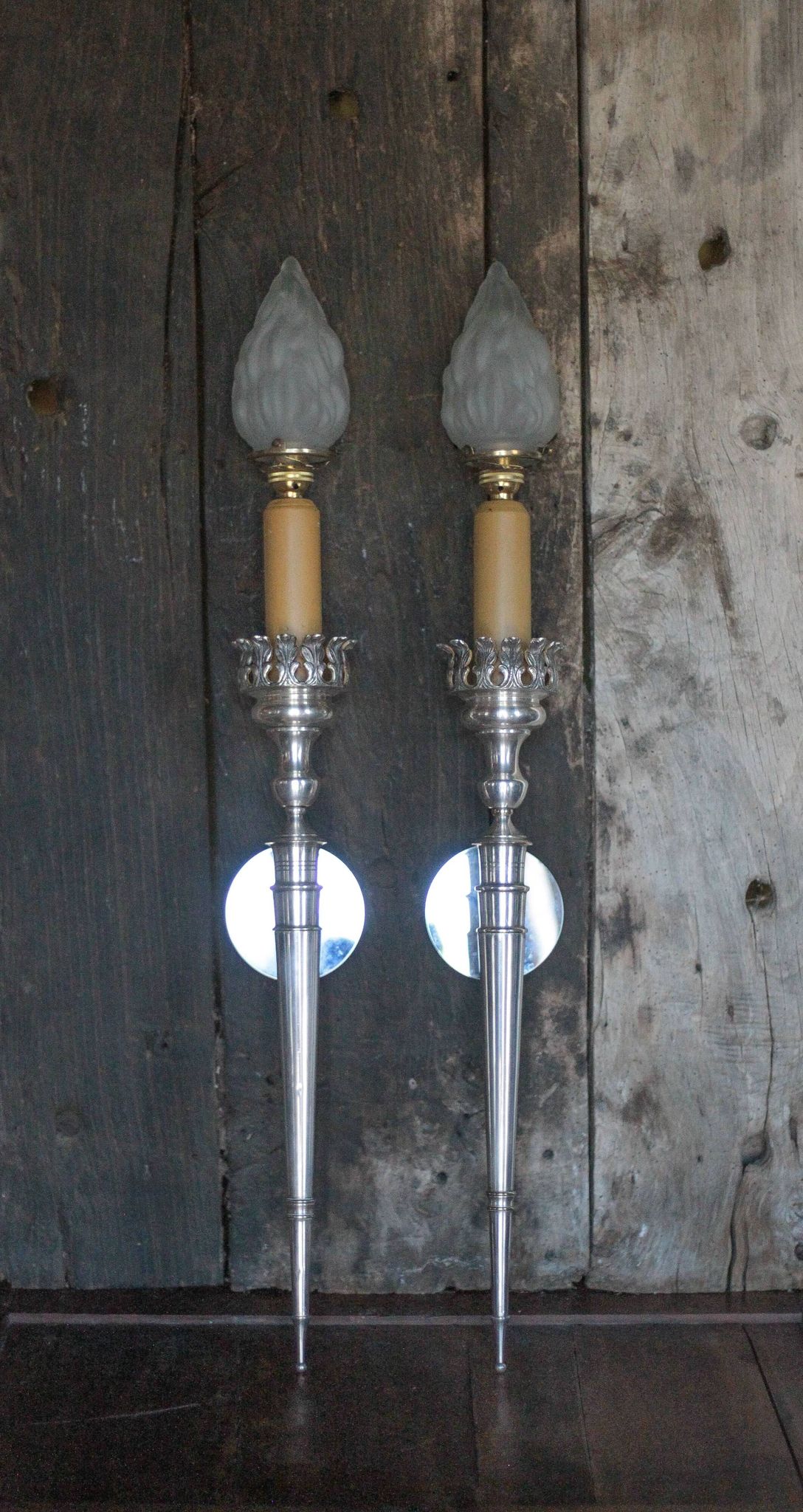 Large pair of silver-plated wall lights with flame globes, torches.