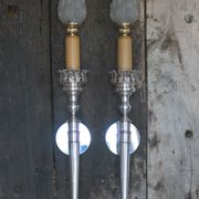 Large pair of silver-plated wall lights with flame globes, torches.