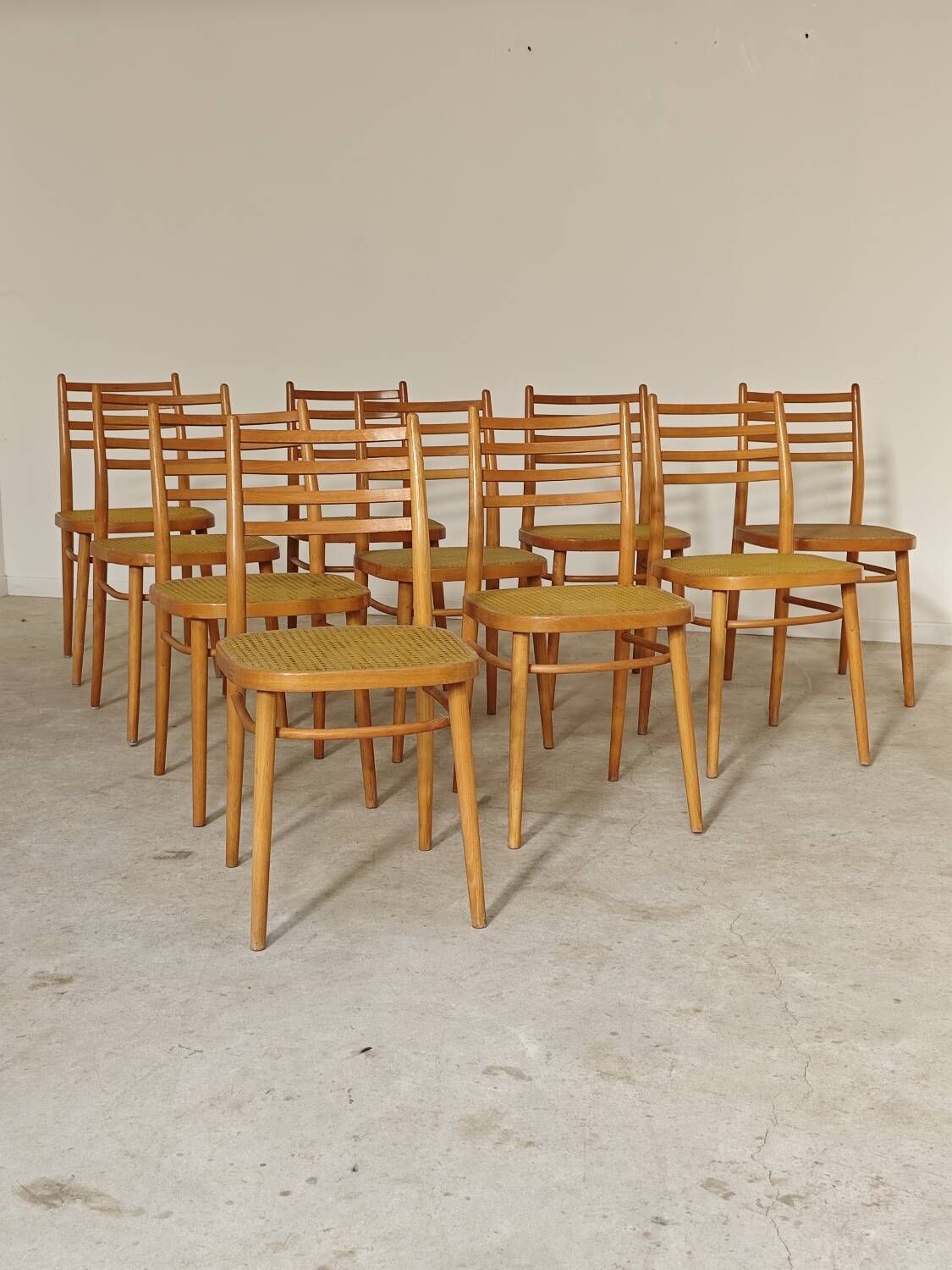 Set of 10 Bystrice tone wooden and caned chairs from the 1960s.