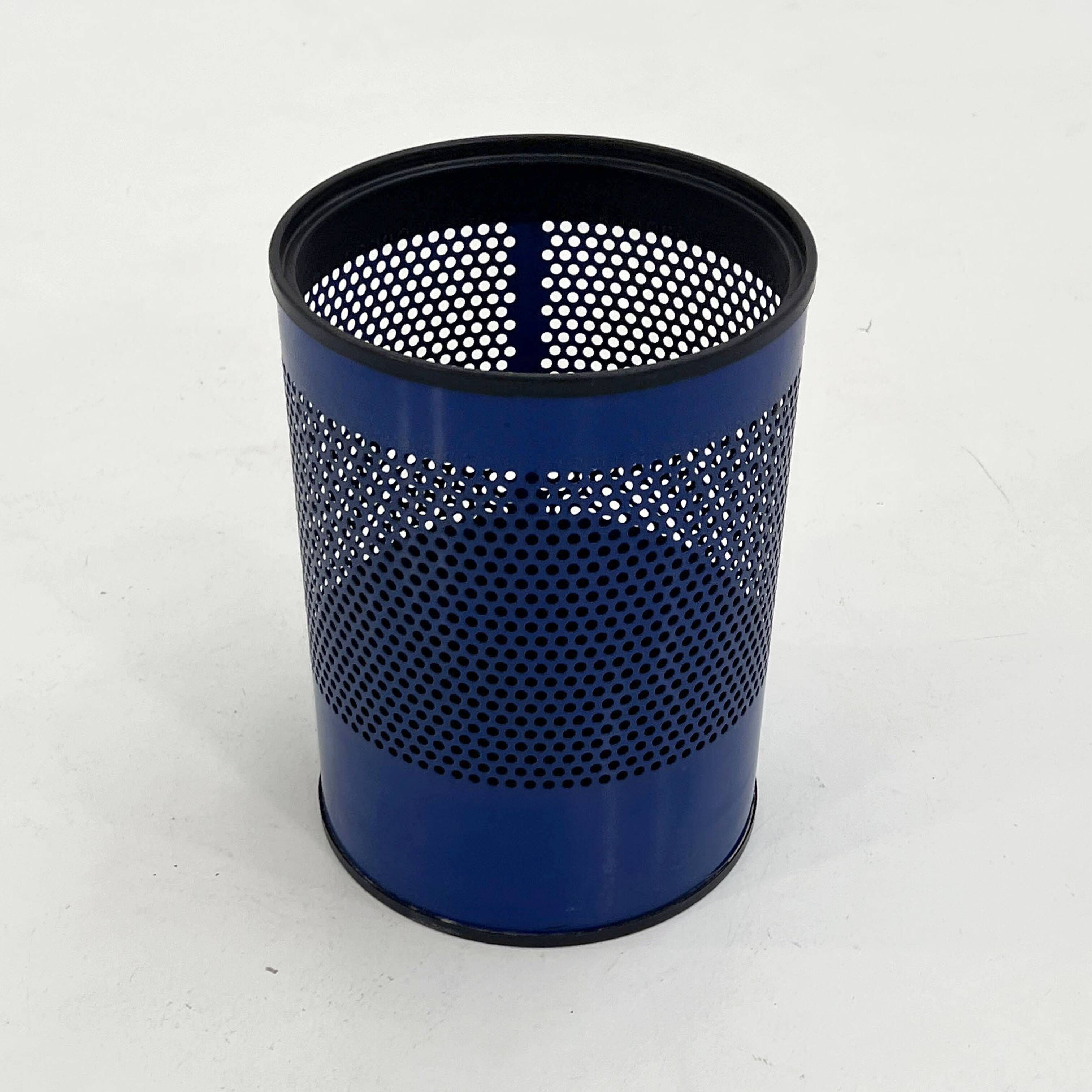 Blue perforated metal bin, 1980