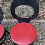 6 vintage Baumann seagull model chairs, black lacquered with red Skai seats.