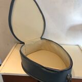 Suitcase has an air hostess hat