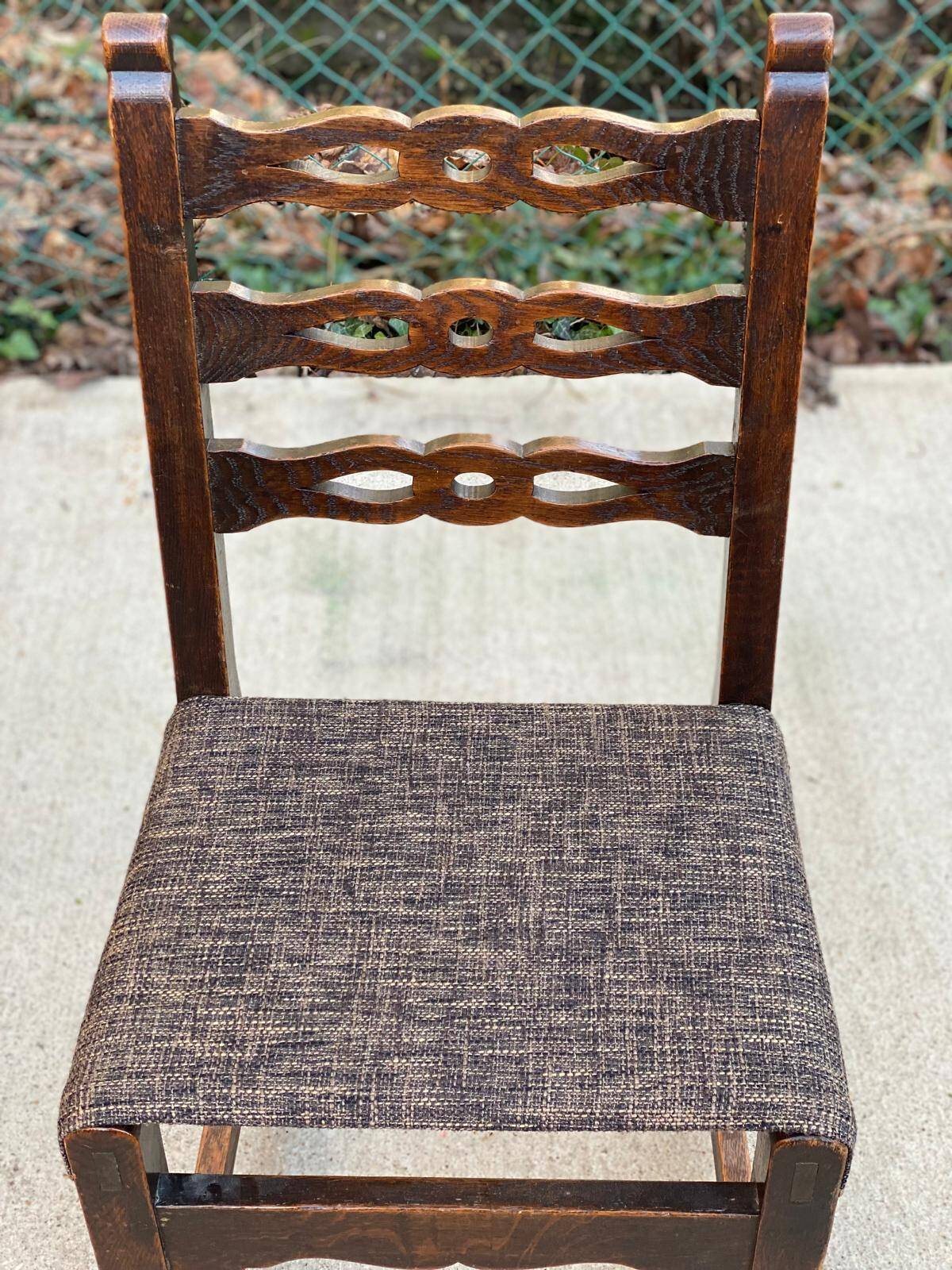 6 solid wood dining chairs with grey woven wool seats.