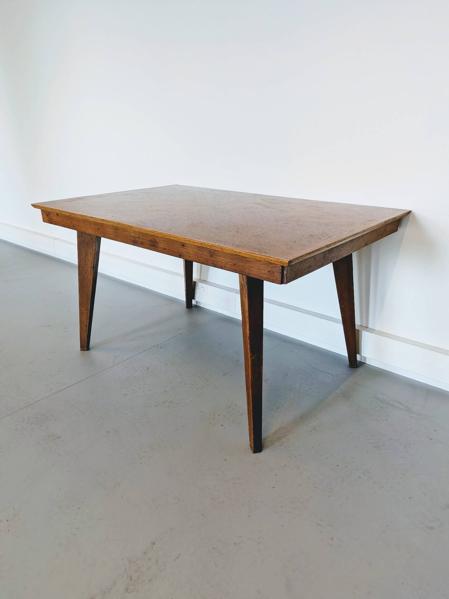 Vintage Scandinavian wooden dining table with tapered legs.