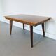 Vintage Scandinavian wooden dining table with tapered legs.