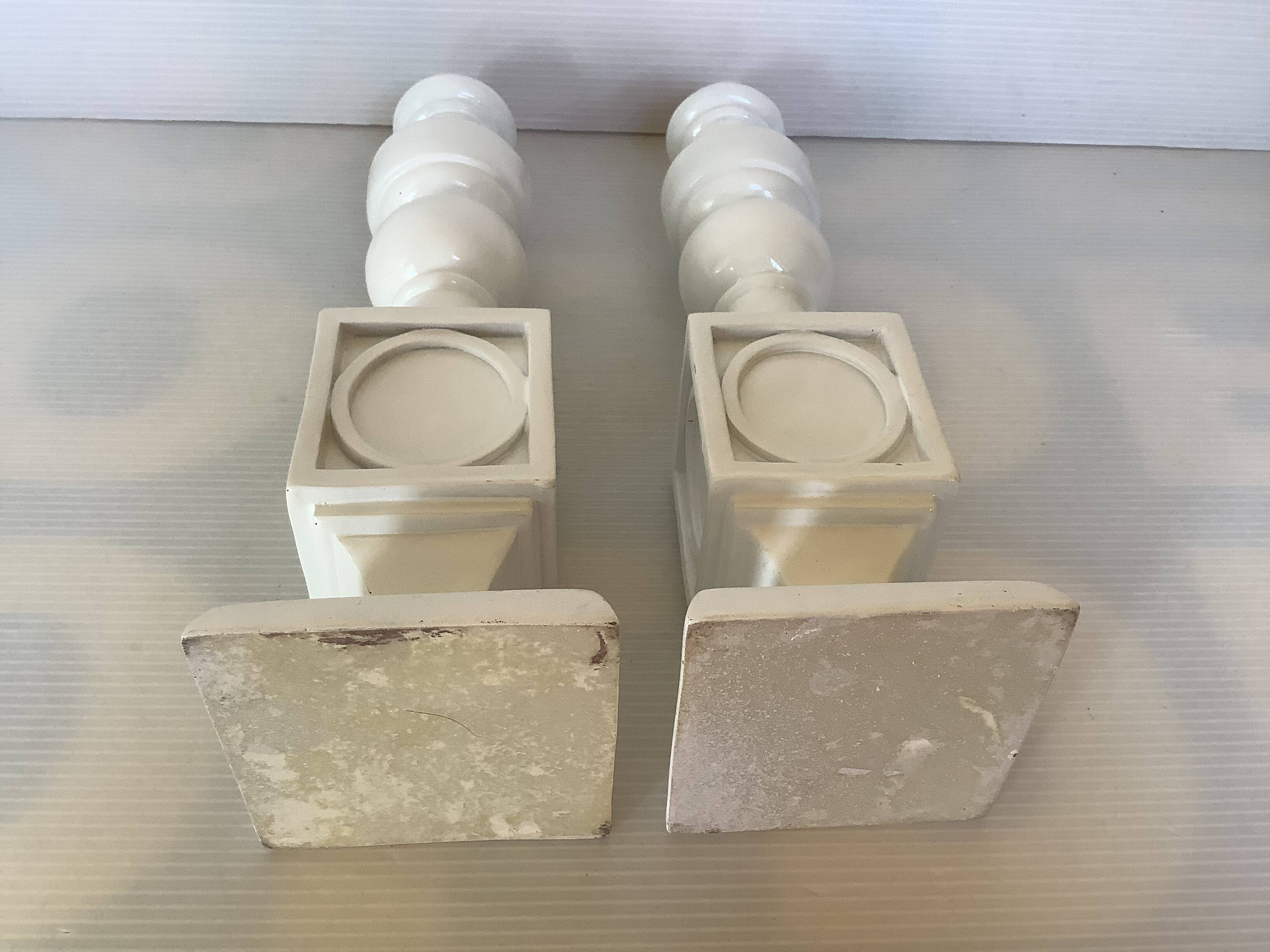 Pair of white resin candle holders