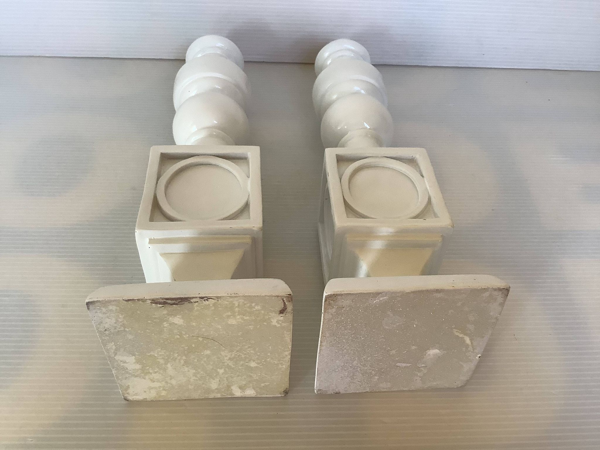 Pair of white resin candle holders