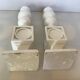 Pair of white resin candle holders