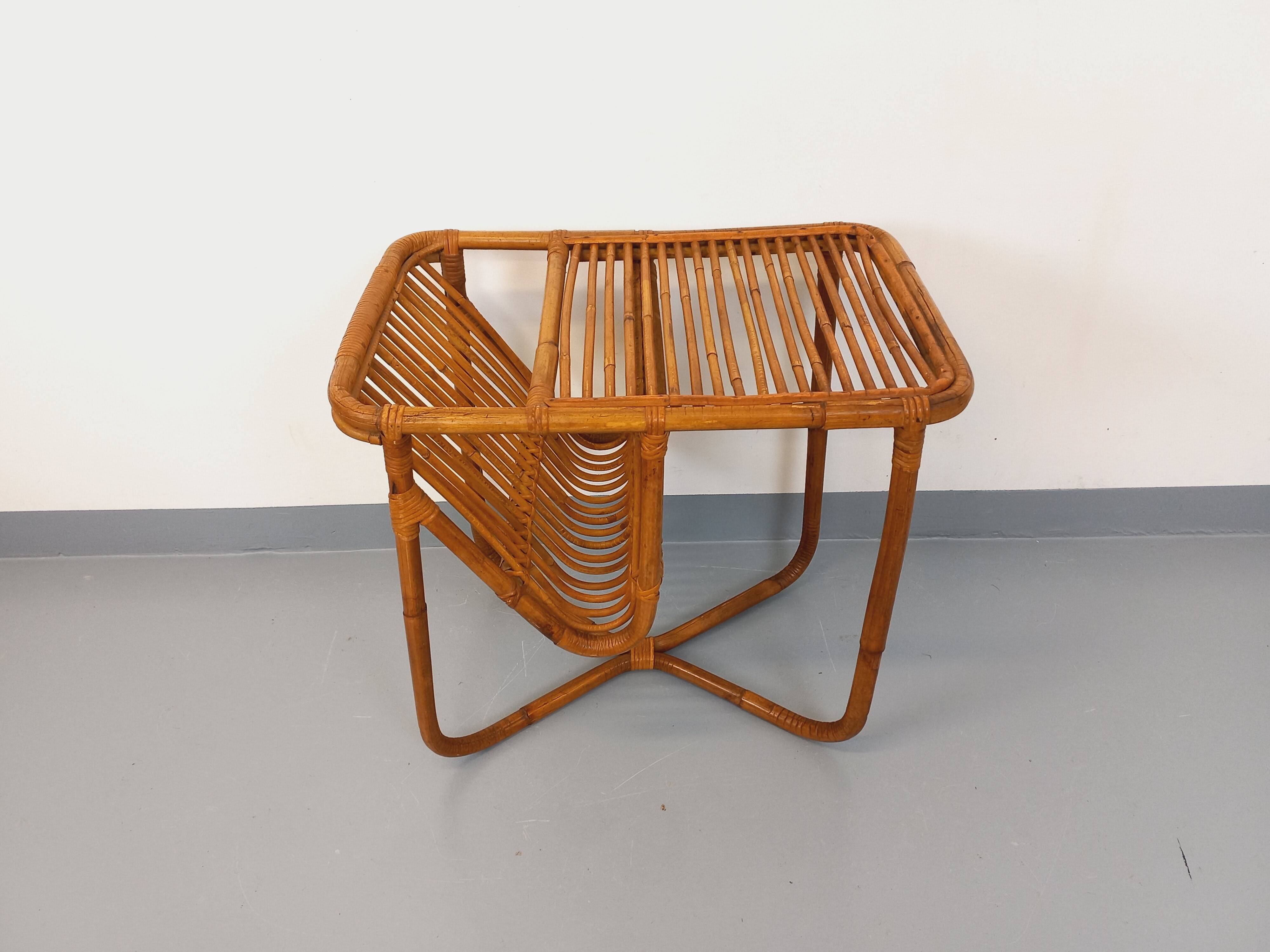 Side table / coffee table with vintage 1960s rattan magazine rack.