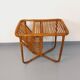 Side table / coffee table with vintage 1960s rattan magazine rack.