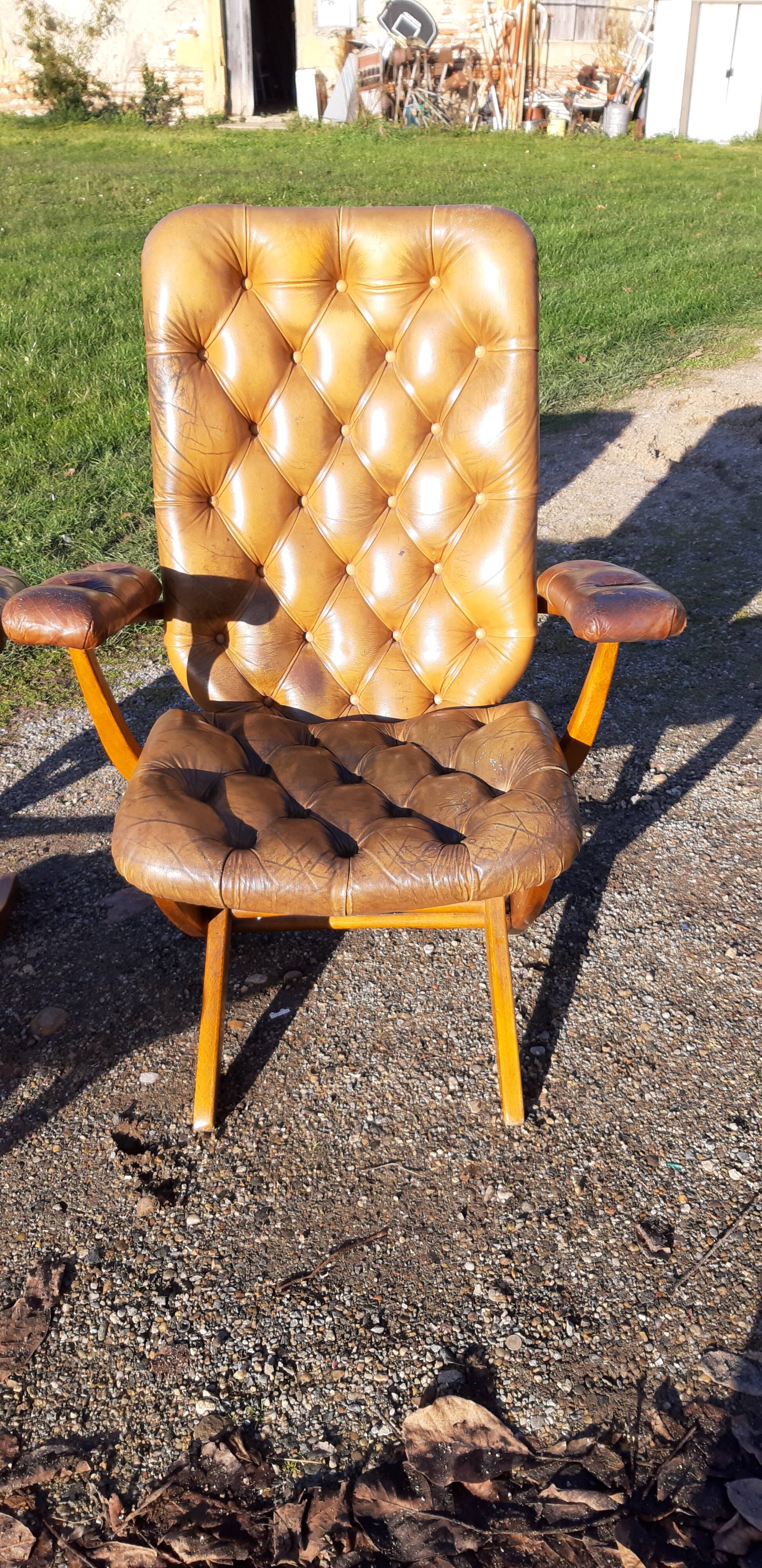 Pair of chesterfield style leather armchairs