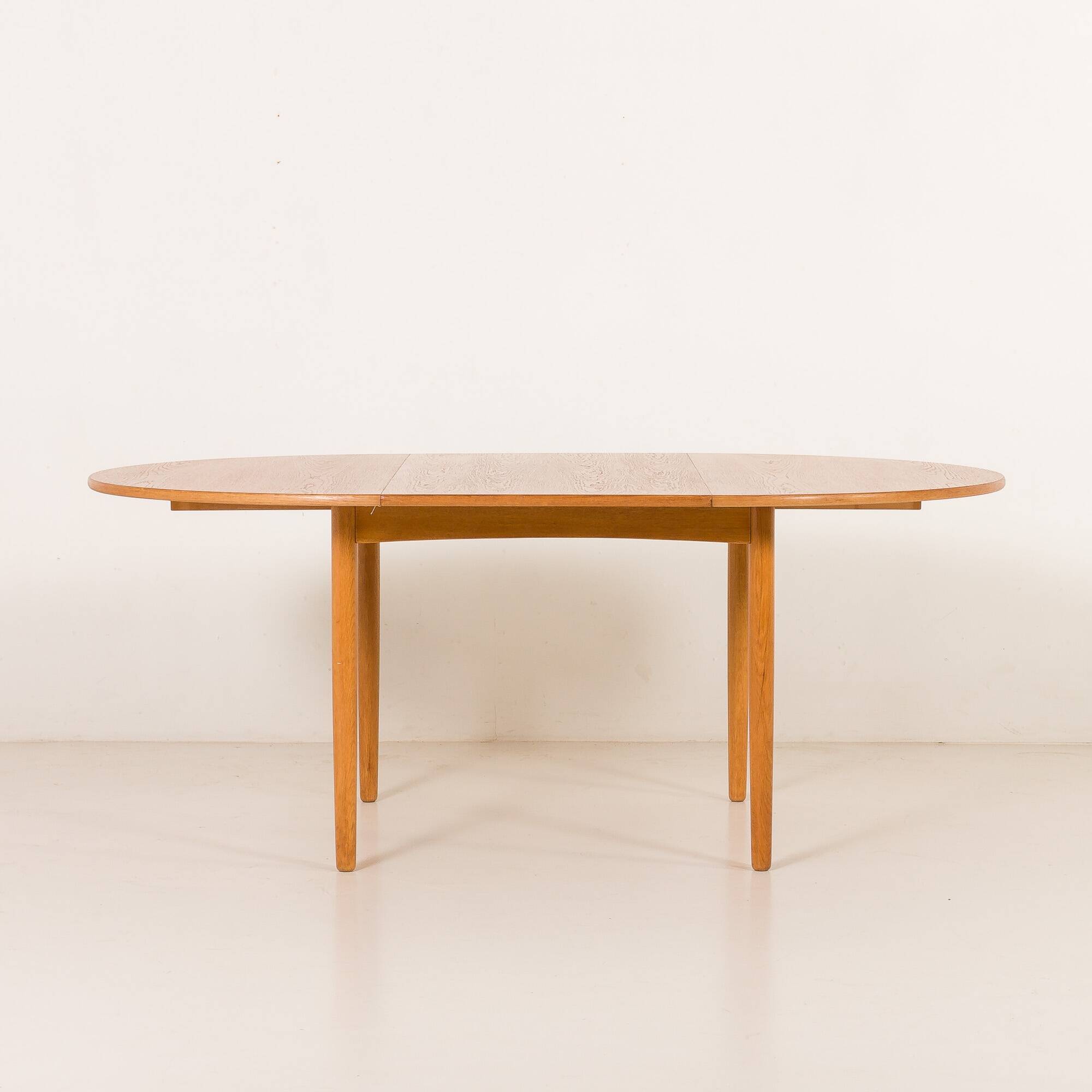 Danish Oak round dining table with one extension, 1970s