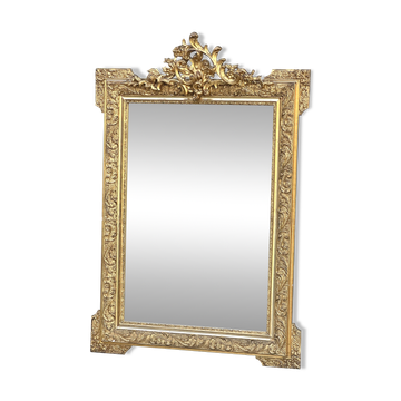 Large antique fireplace mirror with a wooden and gilded stucco pediment, Napoleon III style.