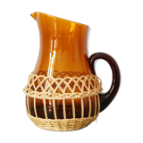 Amber glass decanter dressed in wicker, vintage