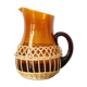 Amber glass decanter dressed in wicker, vintage