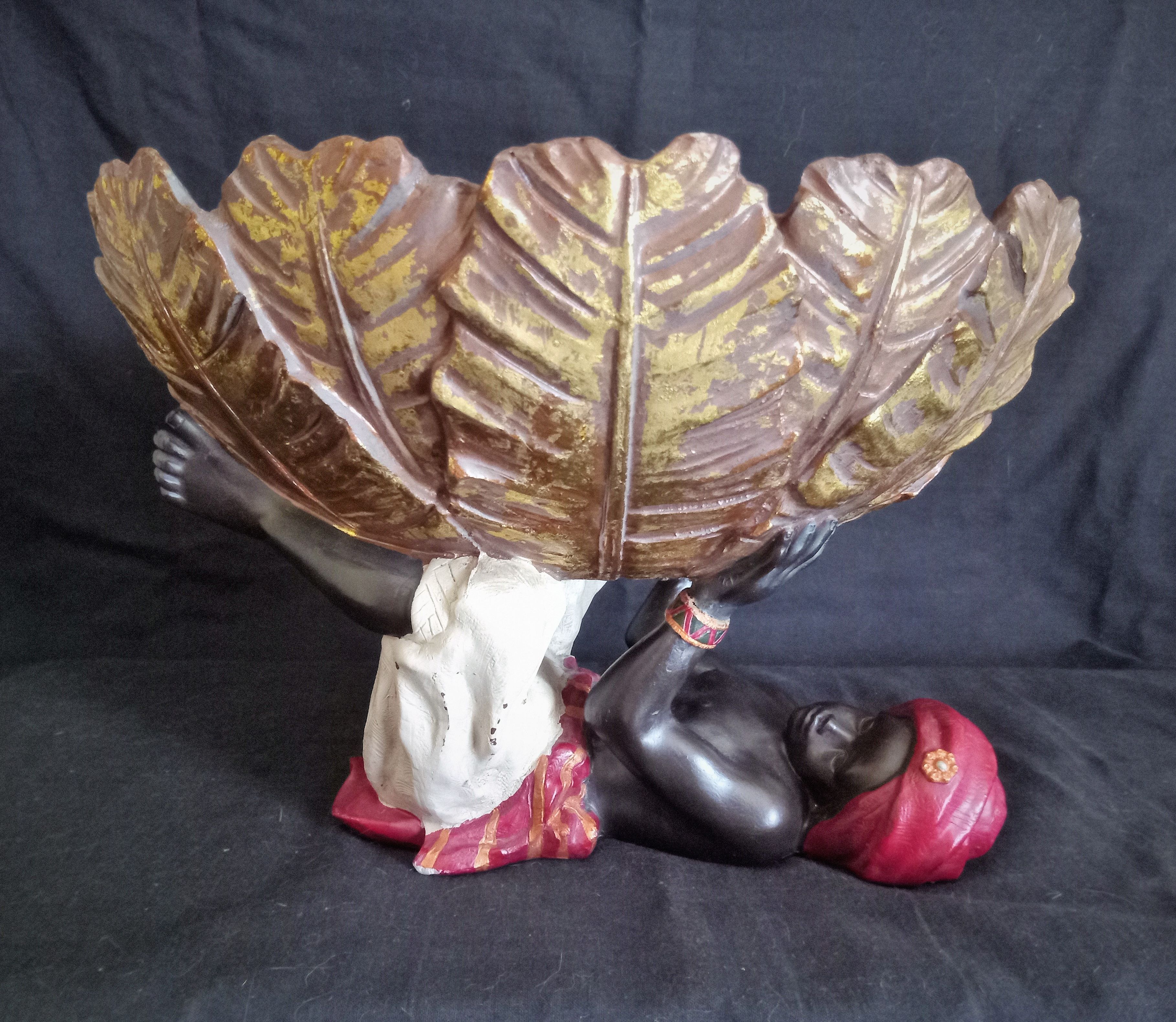 Centerpiece (empty pocket) in resin with African character