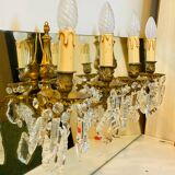 Pair of gilt bronze wall sconces with pendants from the mid-20th century.