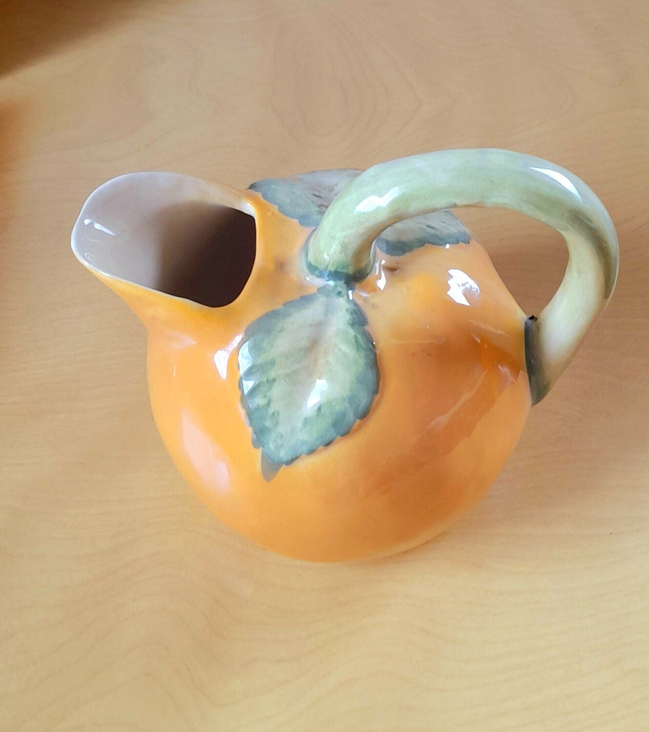 Orange pitcher in slip