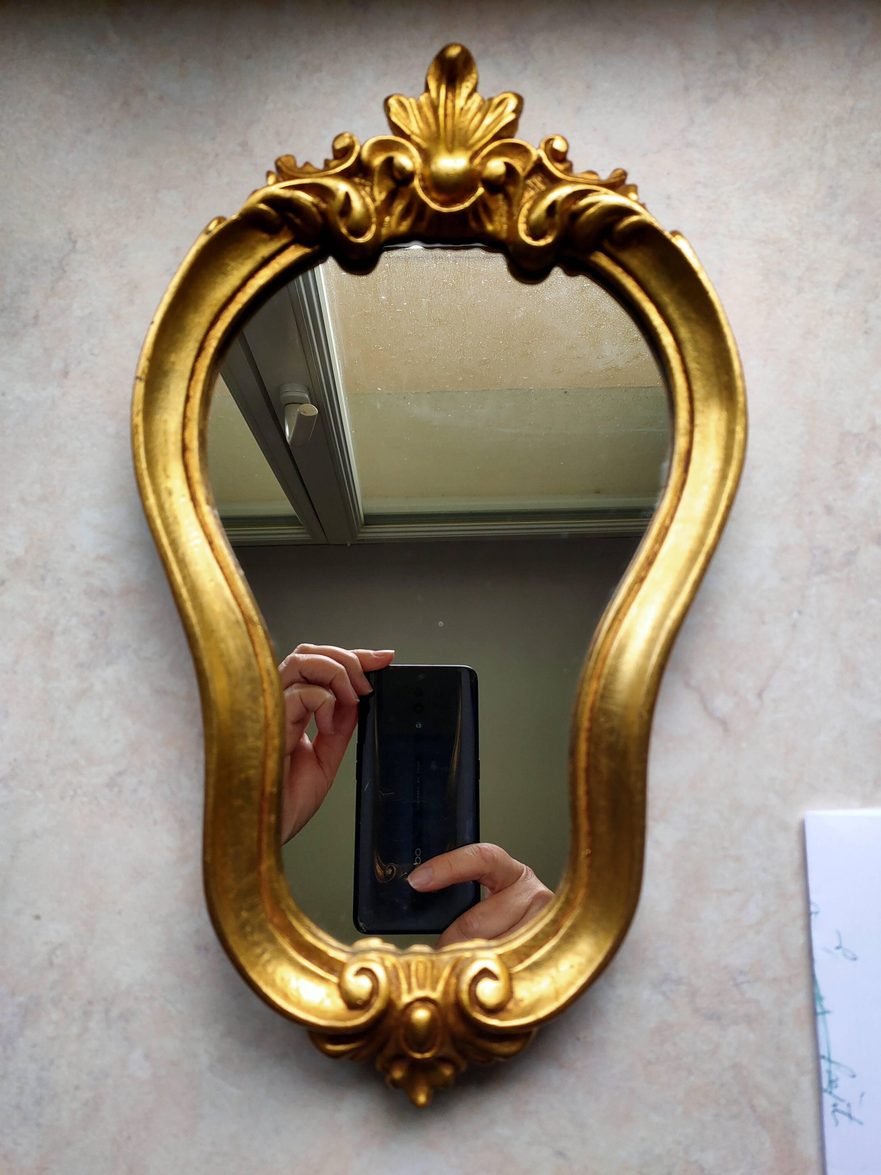 Baroque style gilded mirror.