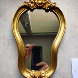 Baroque style gilded mirror.