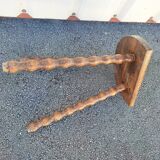 Pretty wooden stool with half moon seat and turned wooden tripod base