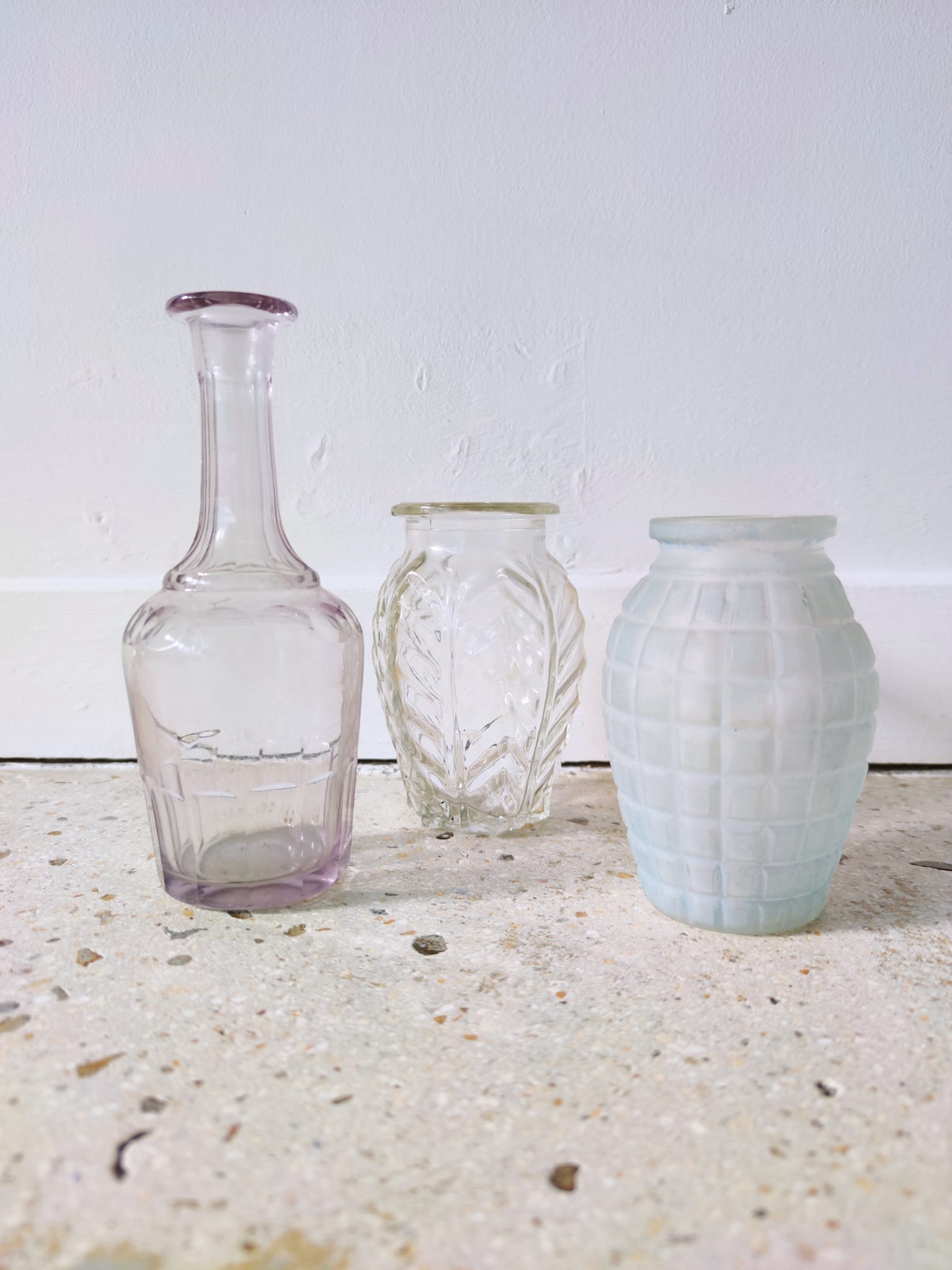 Small transparent molded glass vase