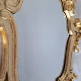 Wooden and gilded mirror with gold leaf