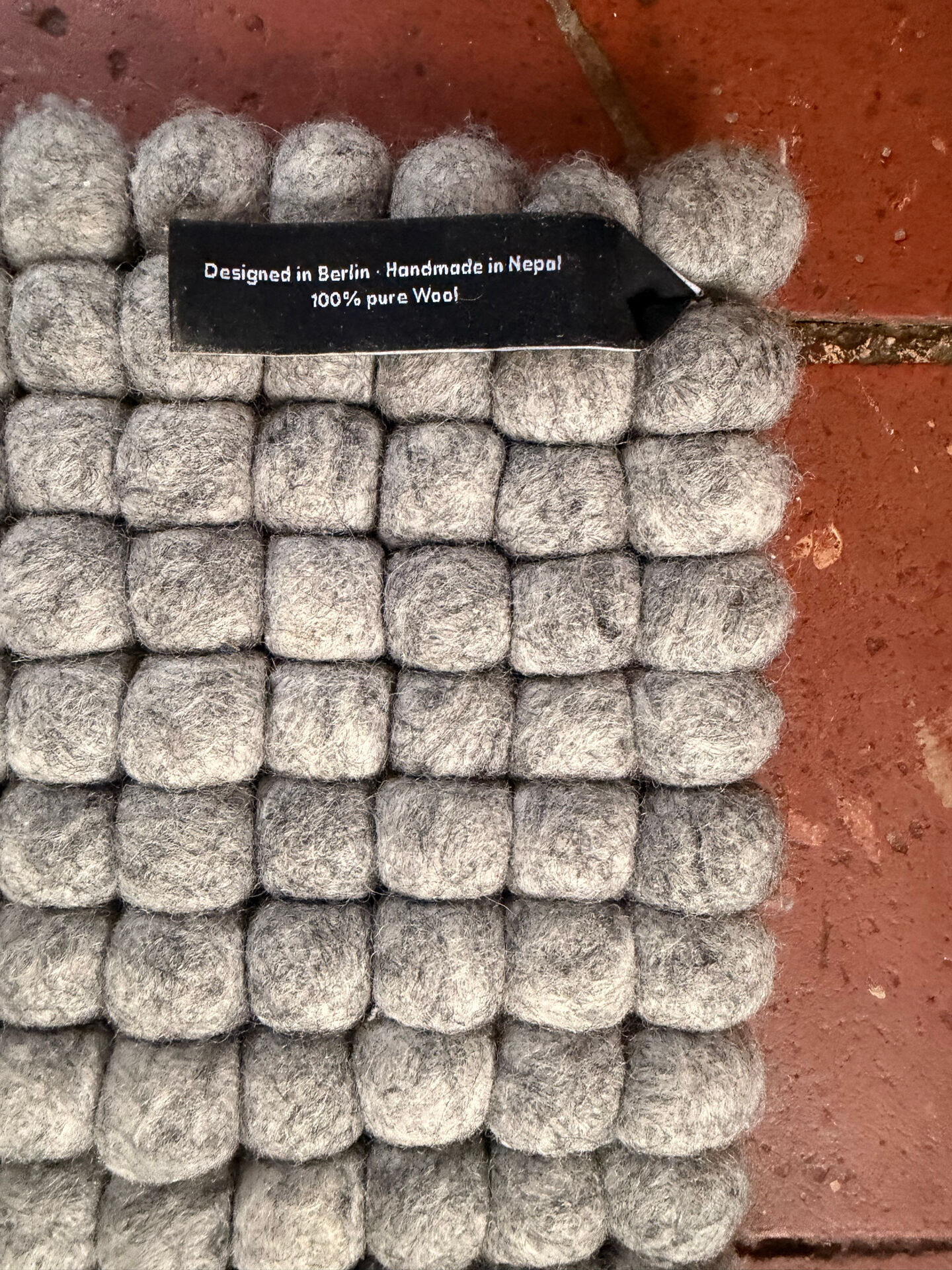 Myfelt rug made of virgin wool felt balls.