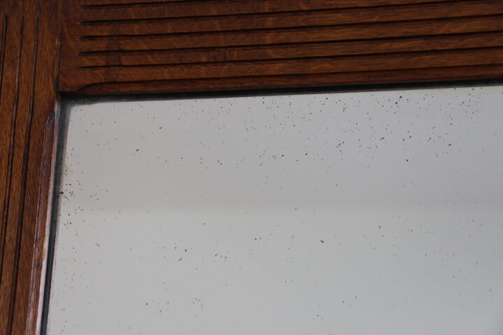 Beveled mirror grooved wood