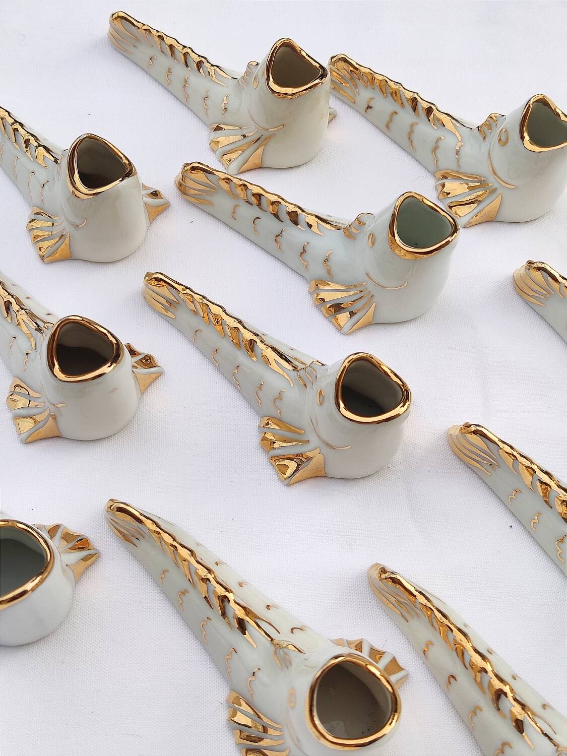 White and gold Limoges porcelain knife rests - animal motif: fish