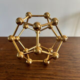 Golden brass atom