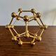 Golden brass atom