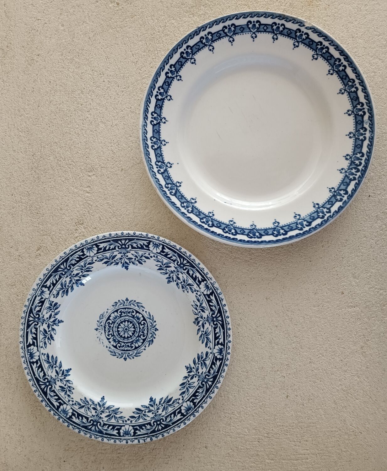 2 mismatched ironstone plates