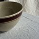 Large speckled beige salad bowl with ochre trim H14 D25
