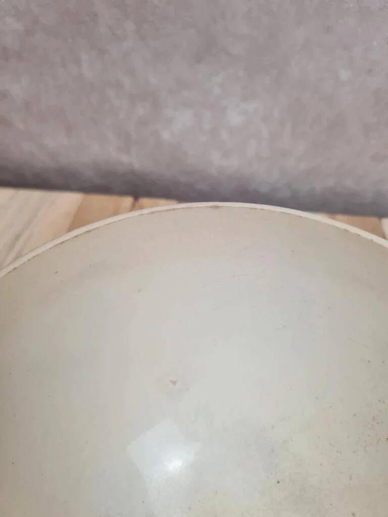 Old ironstone bowl with vintage blue and ochre decoration.
