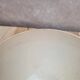 Old ironstone bowl with vintage blue and ochre decoration.