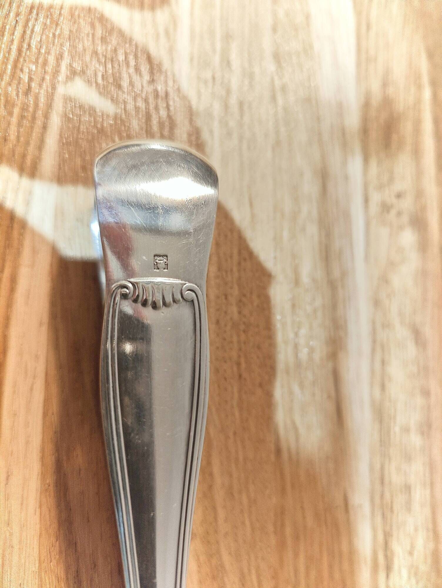 Antique sugar tongs in silvered metal