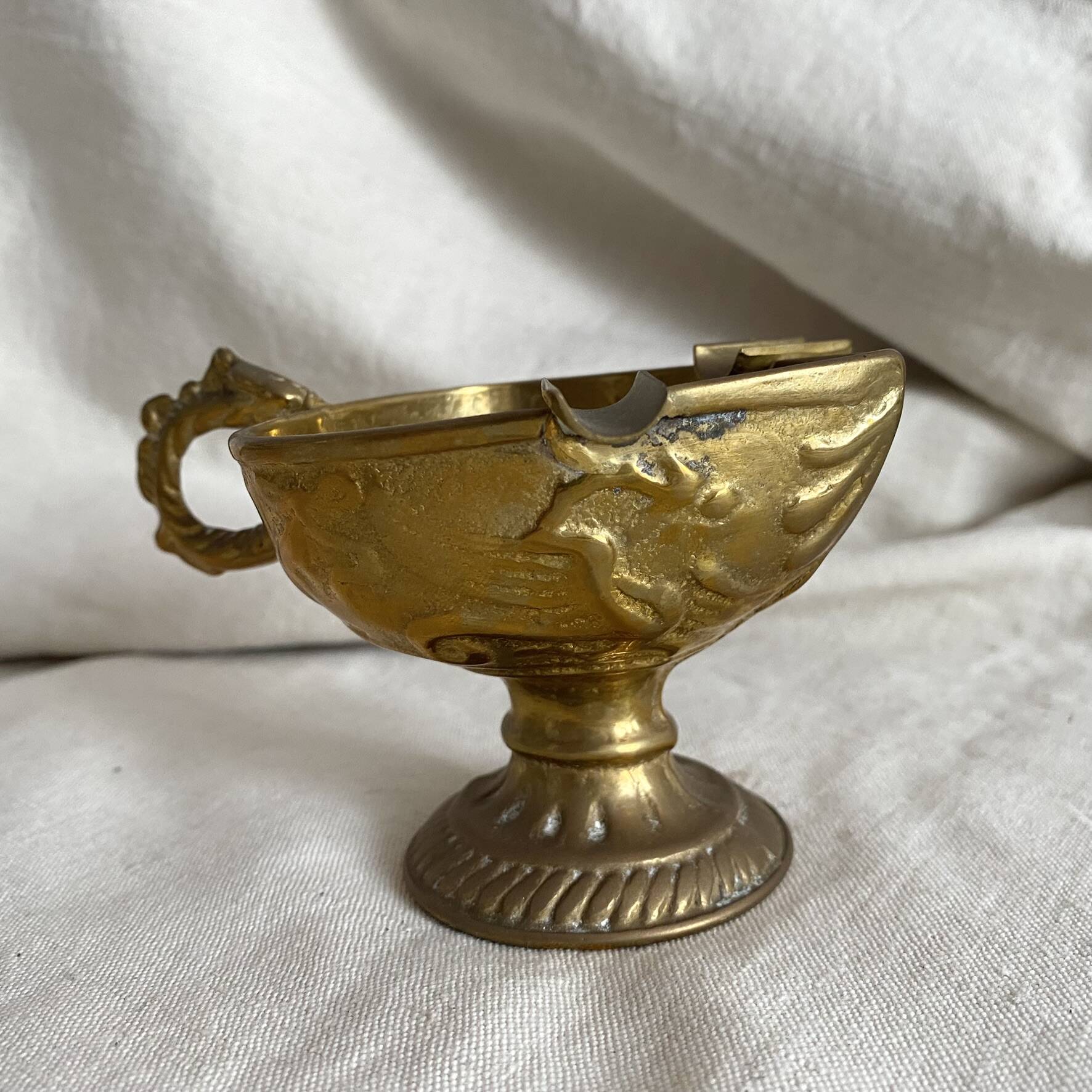 Antique embossed brass ashtray