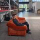 Vintage rust velvet sofa from the 1970s with metal details.