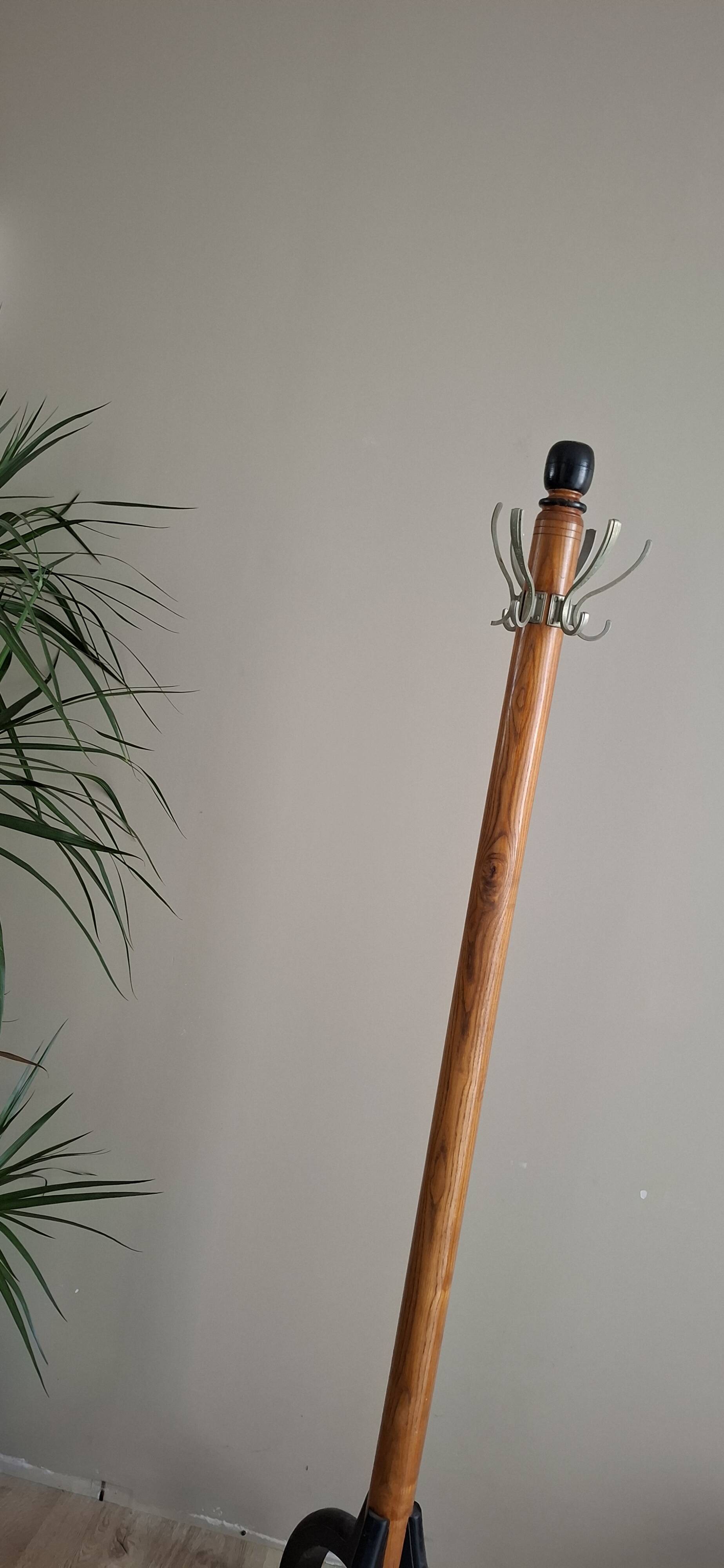 Coat rack on wood and black stand