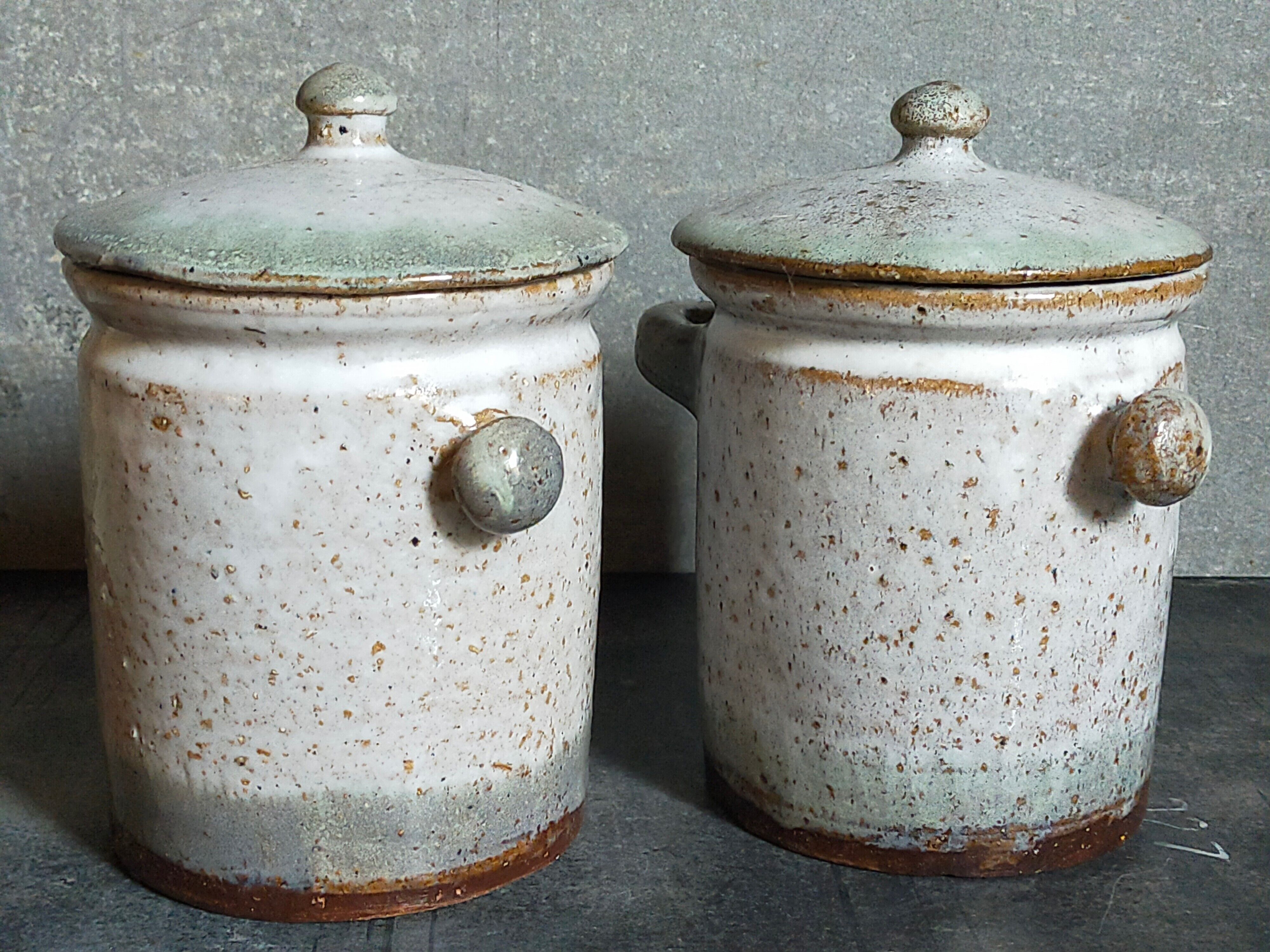 Duo of potter's pots covered in vintage glazed stoneware