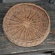 Vintage brown wicker round basket from the 1940s, woven flat, diameter 37 cm.