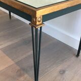 Patinated and gilded steel coffee table in the style of Jacques Quinet.