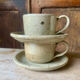 Two large Jean Austruy stoneware cups and saucers